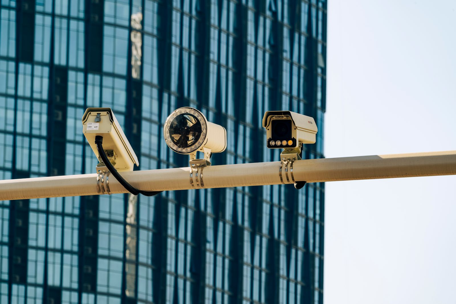 Surveillance cameras mounted on a pole in a city street