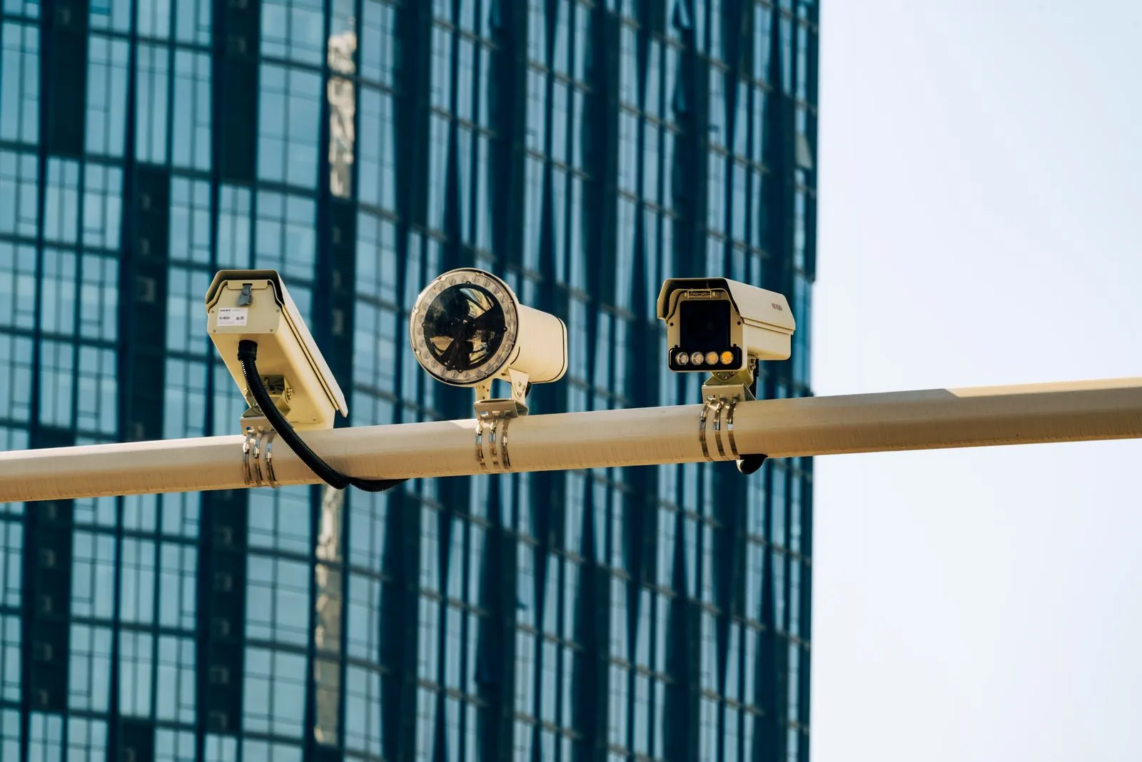 Surveillance cameras mounted on a pole in a city street